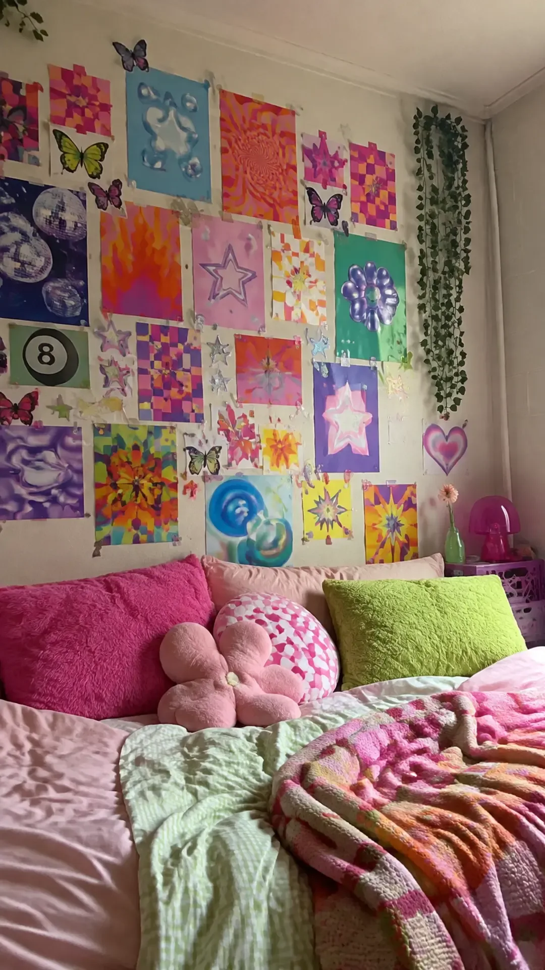 Colorful Y2K poster collage with butterflies and chrome stars on a dorm wall